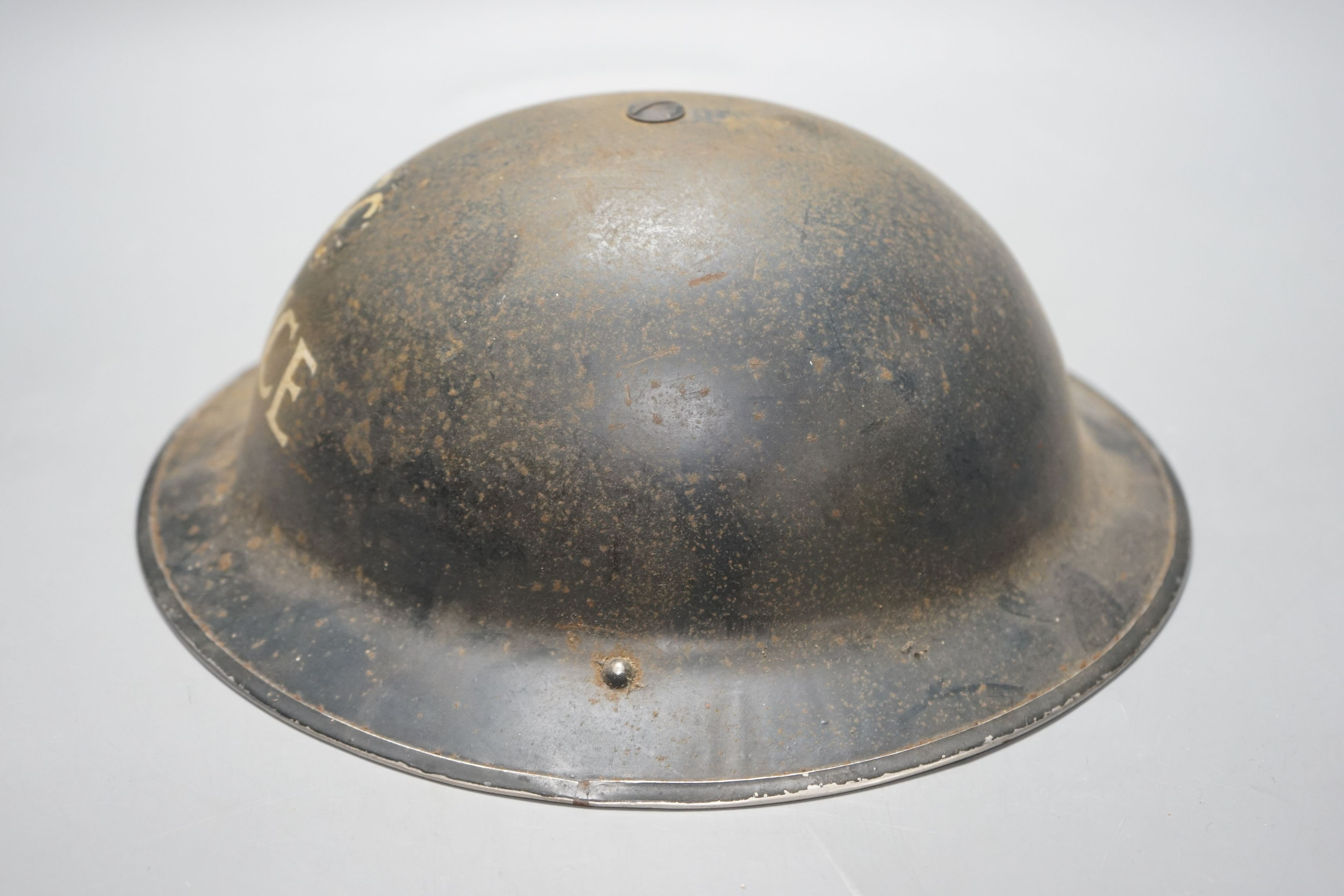 A WW2 period steel Special Constable police helmet, stamped HBH 1938